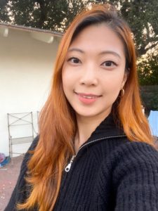 image of Asian female in a black cardigan
